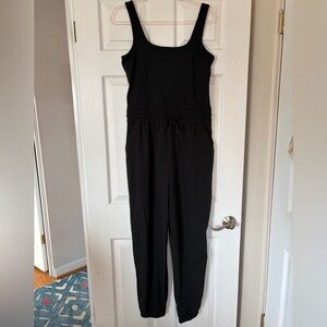 Yogalicious LUX Lightstreme Harmony Jumpsuit in Black. Adjustable straps. SZ L